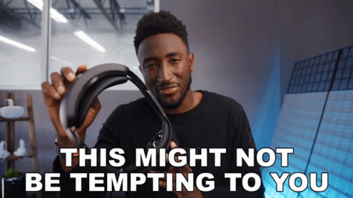 Man Holding Headset Saying This Might Not Be Tempting to You