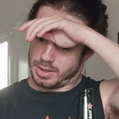 Man Holding Heineken Bottle To Forehead GIF