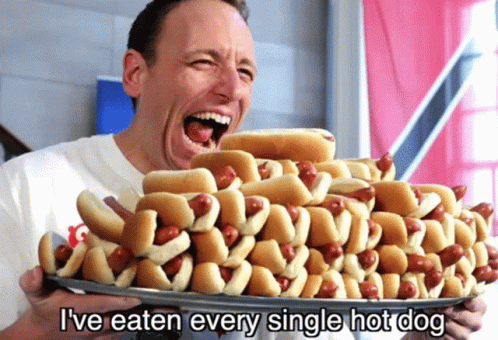 Man Holding Hot Dogs Saying I've Eaten Every Single Hot Dog