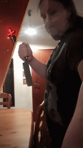 Man Holding Large Knife GIF