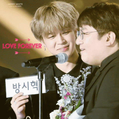 Man Holding Love Forever Sign