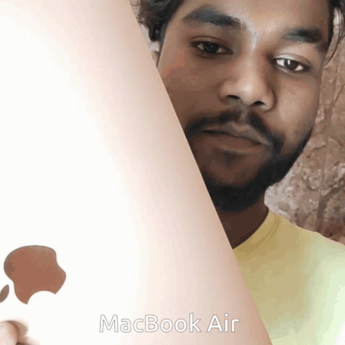 Man Holding MacBook Air