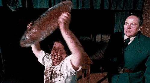 Man Holding Meat Over Head