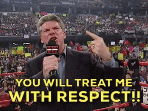 Man Holding Microphone in Front of Crowd Saying You Will Treat Me With Respect