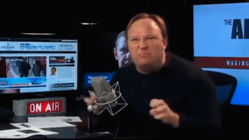 Man Holding Microphone Near On Air Sign