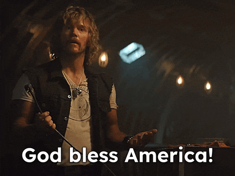 Man Holding Microphone Saying God Bless America