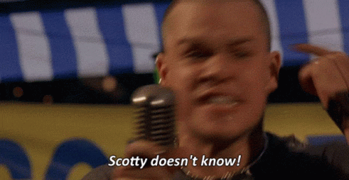 Man Holding Microphone Saying Scotty Doesn't Know