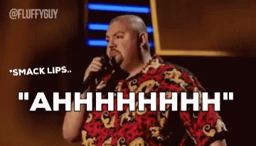 Man Holding Microphone Saying Smack Lips Ahhhh