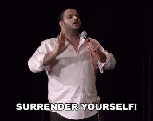 Man Holding Microphone Saying Surrender Yourself