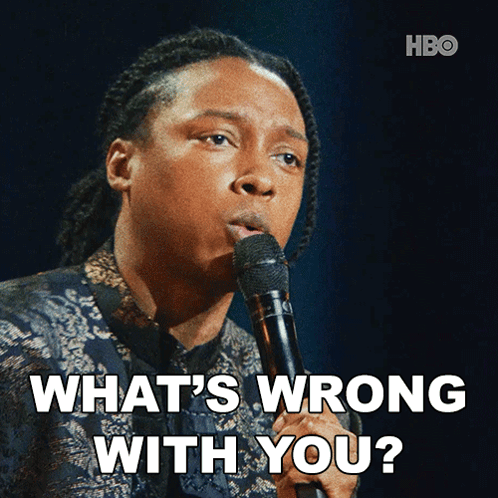 Man Holding Microphone Saying What's Wrong With You