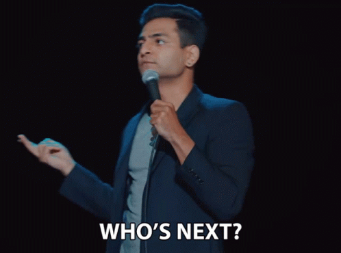 Man Holding Microphone Saying Who's Next GIF