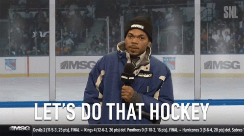 Man Holding Microphone Says Let's Do That Hockey