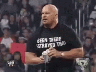 Man Holding Microphone Smoking In Front Of Crowd GIF