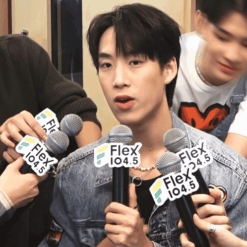 Man Holding Microphone With Flex 104.5 GIF