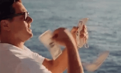 Man Holding Money And Cell Phone GIF