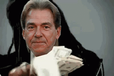Man Holding Money Pointing at Camera