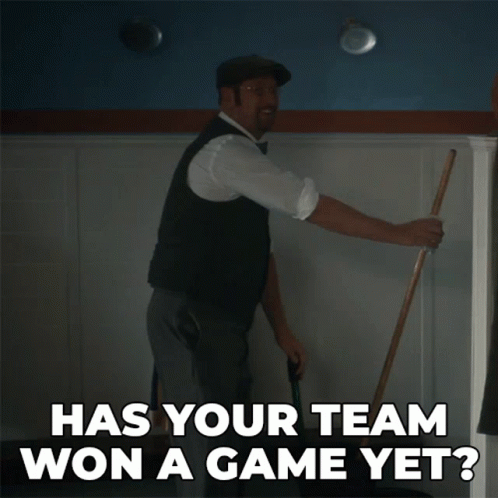Man Holding Mop Says Has Your Team Won Game Yet