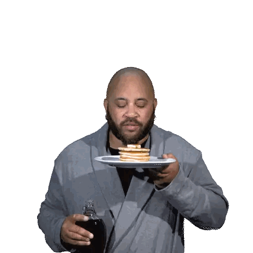 Man Holding Pancakes Saying Good Morning