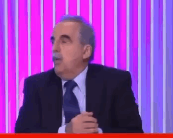 Man Holding Paper Looking At It GIF