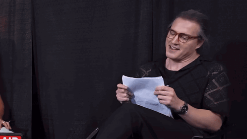 Man Holding Paper Saying I Haven't Thrust in Years