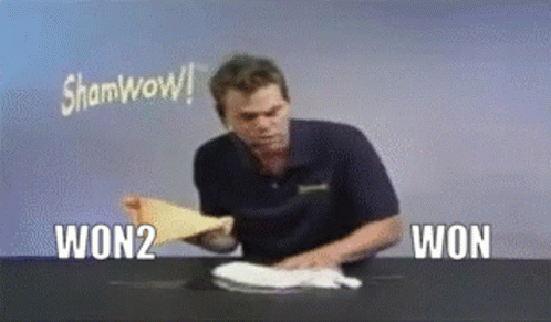 Man Holding Paper Saying Sham Wow