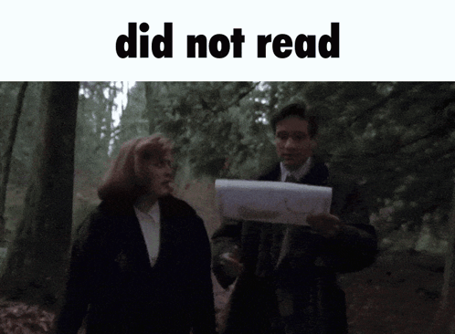 Man Holding Paper Woman Walking in Woods