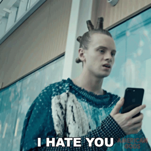 Man Holding Phone Saying I Hate You
