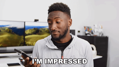 Man Holding Phone Saying I'm Impressed