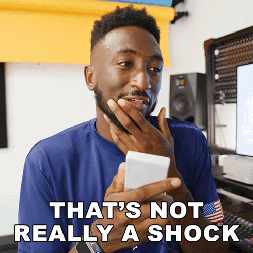Man Holding Phone Saying That's Not Really Shock GIF