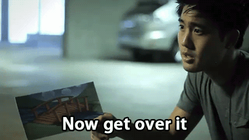 Man Holding Picture Saying Get Over It GIF