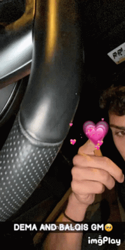 Man Holding Pink Heart Dema and Balqis GM