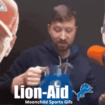Man Holding Pitcher With Detroit Lions Logo GIF
