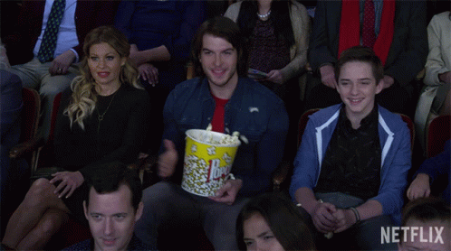 Man Holding Popcorn Bucket Netflix GIF
