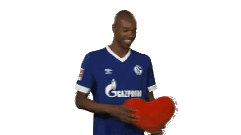Man Holding Red Heart Gazprom Shirt