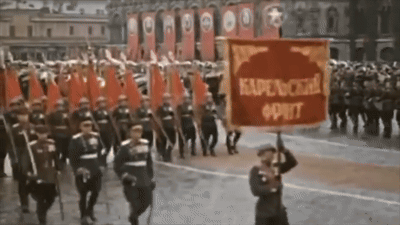 Man Holding Red Kapenckha Oprit Banner