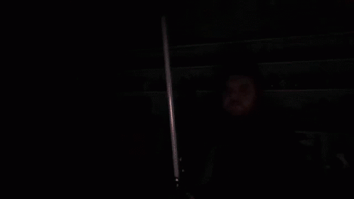 Man Holding Red Lightsaber