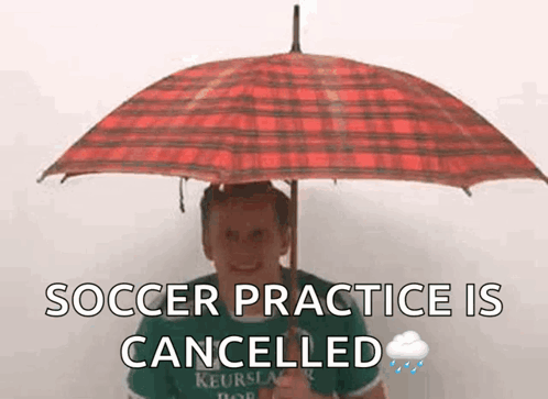 Man Holding Red Plaid Umbrella Soccer Practice Cancelled