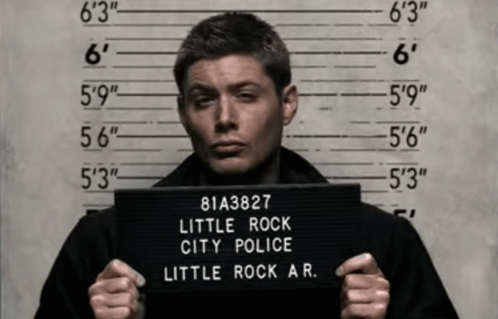 Man Holding Rock City Police Mugshot GIF