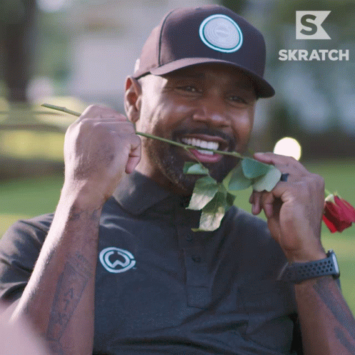 Man Holding Rose in Mouth with S