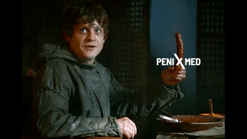 Man Holding Sausage Saying Penis Med GIF