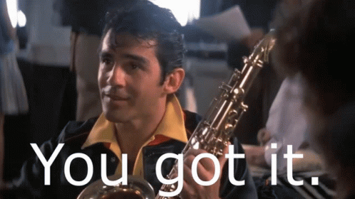 Man Holding Saxophone Saying You Got It GIF