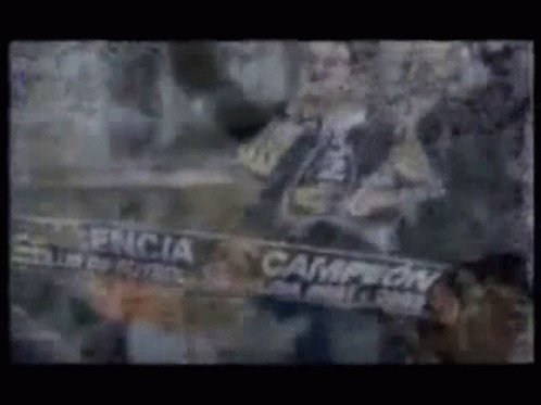 Man Holding Scarf Saying Campeon GIF