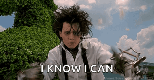 Man Holding Scissors and Saying I Know I Can