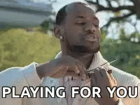 Man Holding Scissors Saying Playing For You