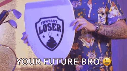 Man Holding Shield Saying Fantasy Loser