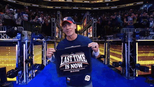 Man Holding Shirt Saying Last Time Is Now GIF