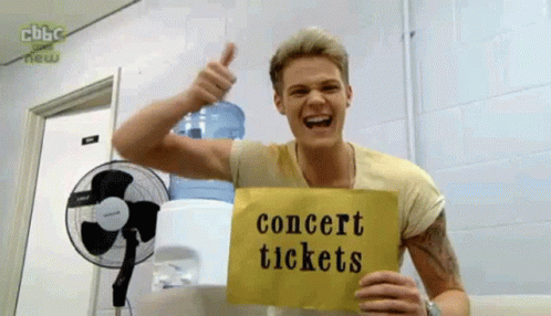 Man Holding Sign Concert Tickets
