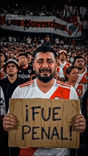 Man Holding Sign Saying Ifue Penal