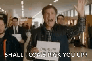 Man Holding Sign Saying Shall I Come Pick You Up