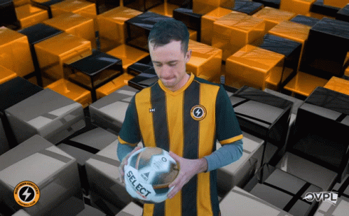 Man Holding Soccer Ball Saying Select